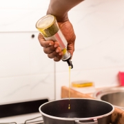 Kitchen gadget pour spout being used in home chefs kitchen