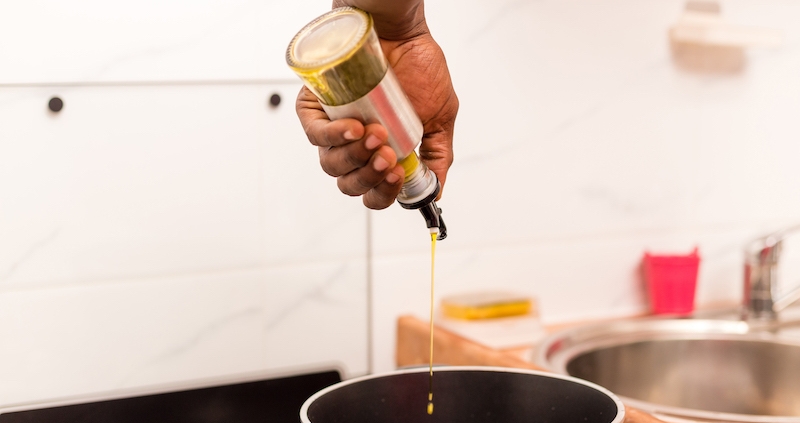 Kitchen gadget pour spout being used in home chefs kitchen