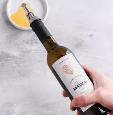 person pouring oil into a dish - Olive Oil Pour Spouts wholesale olive oil pour spouts