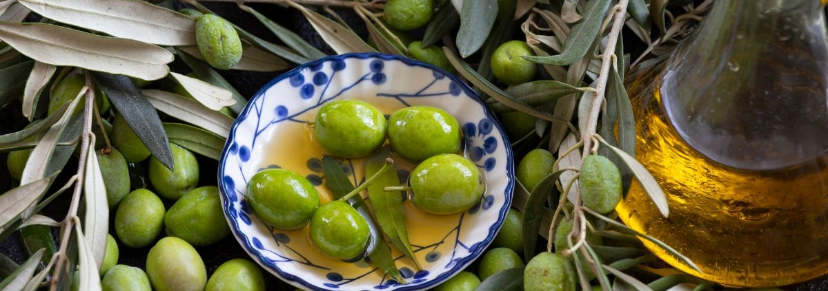 bowl of olives in olive oil - Anytime Olive Oil Products Drip-free olive oil spout