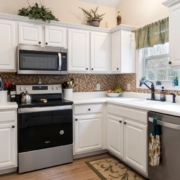 kitchen with white cabinets and light wood counters - Anytime Olive Oil Products olive oil pour spouts