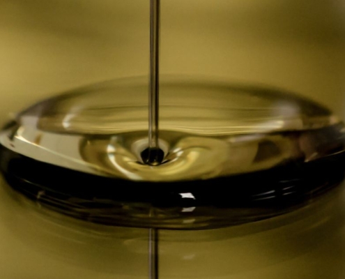 olive oil pouring into a bowl - Anytime Olive Oil Products Preventing oil oxidation