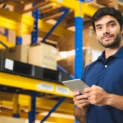 man wearing a blue shirt working in a wholesale facility - Olive Oil Pour Spouts wholesale olive oil pour spouts