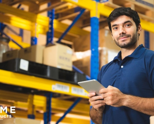 man wearing a blue shirt working in a wholesale facility - Olive Oil Pour Spouts wholesale olive oil pour spouts