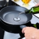 person pouring oil into a fry pan - Olive Oil Pour Spouts Commercial-Grade Olive Oil Spouts
