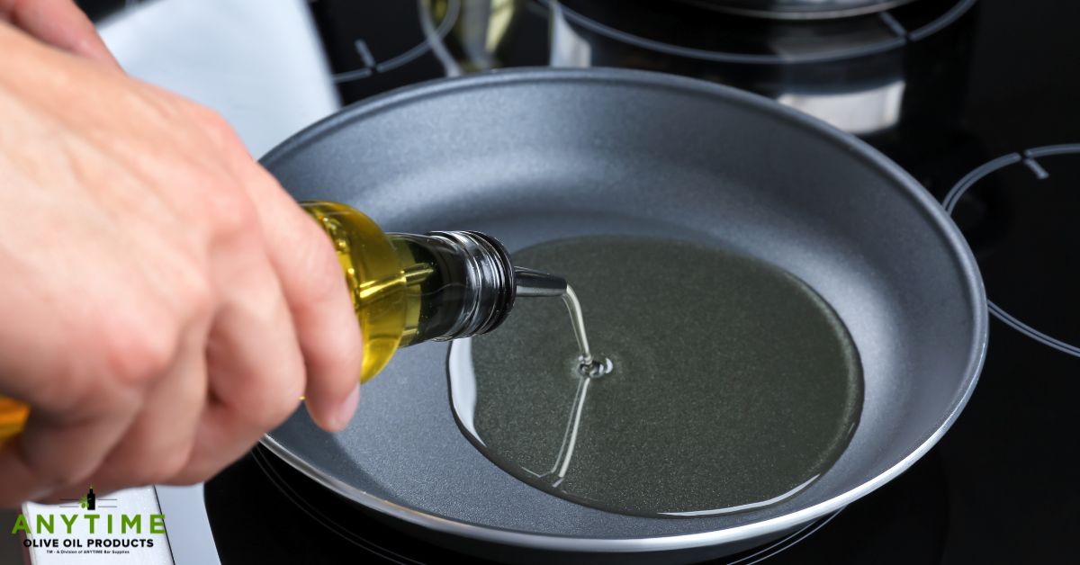 person pouring oil into a fry pan - Olive Oil Pour Spouts pour spout types