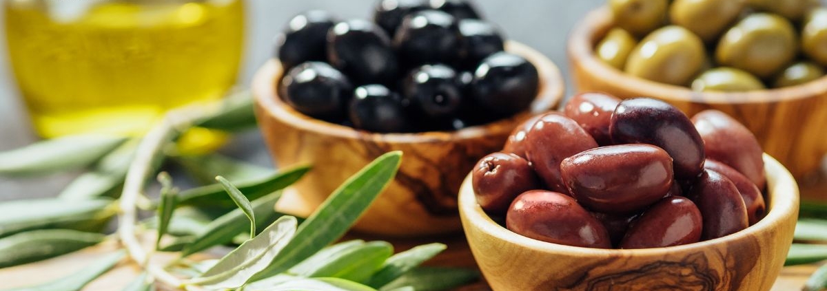 bowls of olives and a jar of olive oil - Anytime Olive Oil Products wholesale olive oil pour spouts