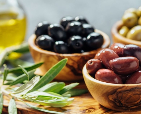 bowls of olives and a jar of olive oil - Anytime Olive Oil Products wholesale olive oil pour spouts