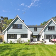 exterior of a suburban home with white brick - Anytime Olive Oil Products oil pour spout