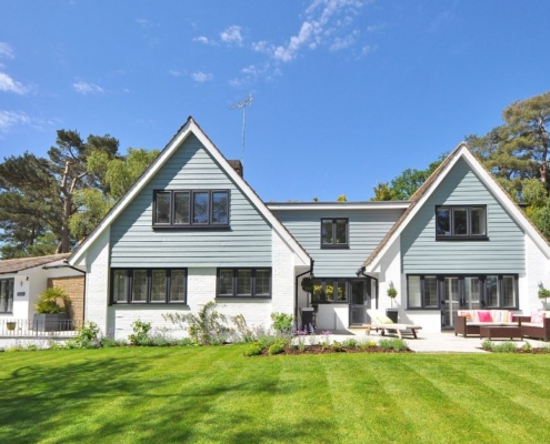exterior of a suburban home with white brick - Anytime Olive Oil Products oil pour spout