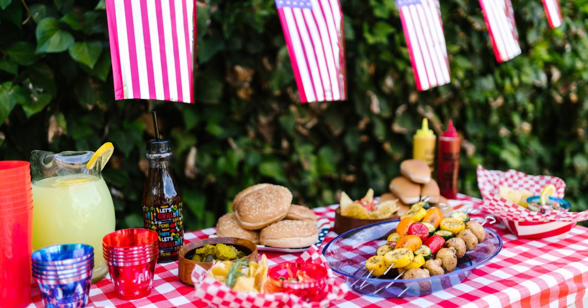 table with a red gingham cloth at a summer bbq - Anytime Olive Oil Products oil pour spout