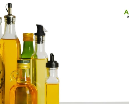 row of oil bottles lined up together - Anytime Olive Oil Products pour spout types