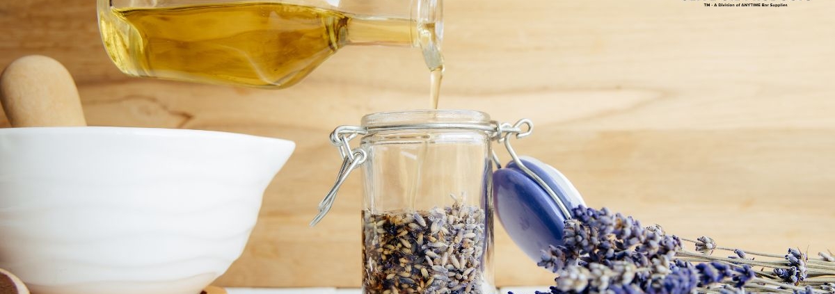 bottle of oil with herbs - Anytime Bar Supplies olive oil