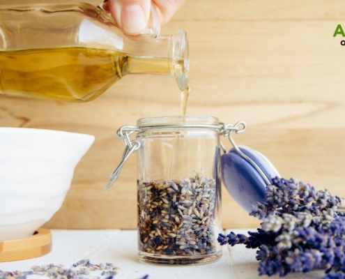 bottle of oil with herbs - Anytime Bar Supplies olive oil