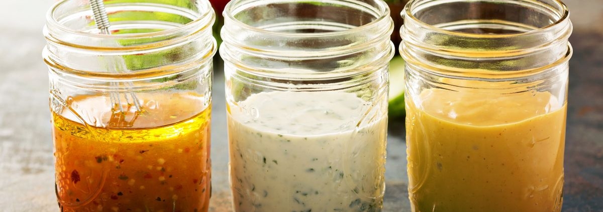 clear glass jars containing homemade salad dressing - Olive Oil Pour Spouts