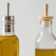 side by side of two glass bottles of olive oil - Olive Oil Pour Spouts