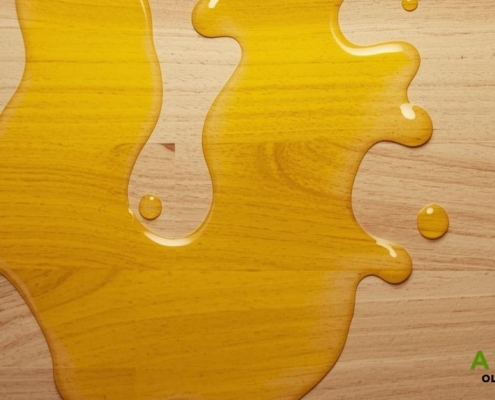 spilled olive oil on a butcher block countertop - Olive Oil pour spout how to keep olive oil fresh
