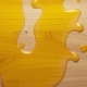 spilled olive oil on a butcher block countertop - Olive Oil pour spout