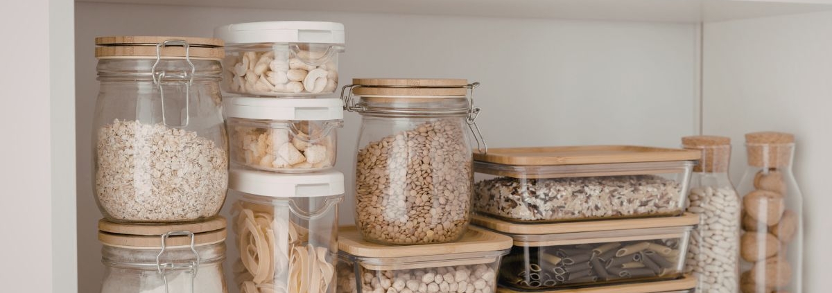 interior of a kitchen pantry with containers of dry goods - Olive Oil Pour Spouts kitchen organization reset