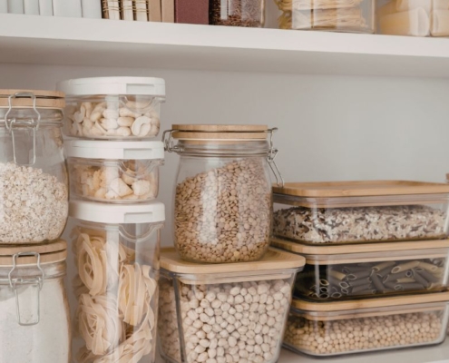 interior of a kitchen pantry with containers of dry goods - Olive Oil Pour Spouts kitchen organization reset