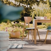 AnytimeOliveOilProducts-drip-free-olive-oil-pour-spouts-050420261 patio area with an empty table and planters - Anytime Olive Oil Products Drip-Free Olive Oil Pour Spouts